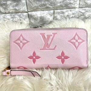 Authentic Louis Vuitton Monogram Empreinte By The Pool Zippy Wallet